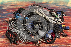 Disused stack of computer cables and devices