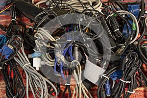 Disused stack of old computer cables and devices