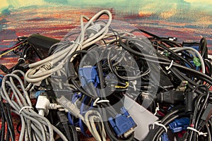 Disused stack of old computer cables and devices