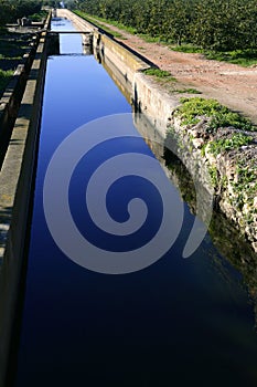 Ditch, arabic water channel for agriculture, Spain photo