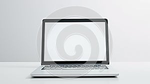 white notebook with brith white screen in front of white background