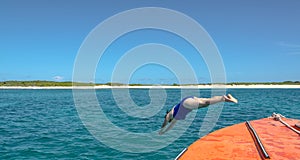 Dive In - Woman Dives Into Caribbean Sea photo