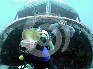 A Diver Emerges From the Nose of a Sunken DC-3 in the Marshall Islands