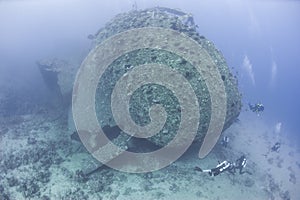 Diver exploring a large shipwreck