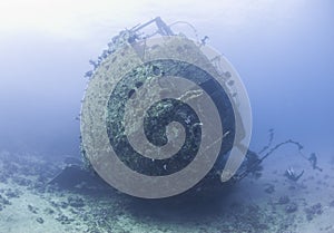 Diver exploring a large shipwreck