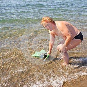 Diver with fins, tube and mask for a scuba diving