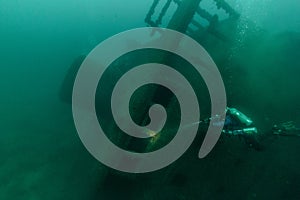 A diver investigates a Lake Michigan shipwreck