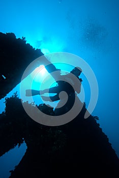 A diver passing through the stern section of