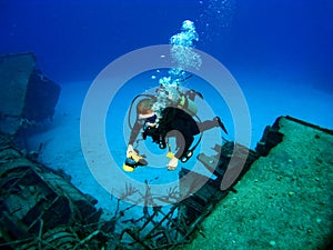 Diver photographing a Sunken Shipwreck