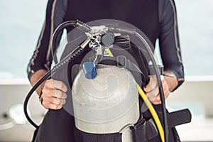 Diver prepares his equipment for diving in the sea