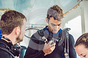 Diver prepares his equipment for diving in the sea