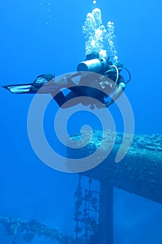 Diver sails through wreckage of the Salem Express wreck, sunk in the Red Sea in 1911, Safaga, Egypt. The diver explores.