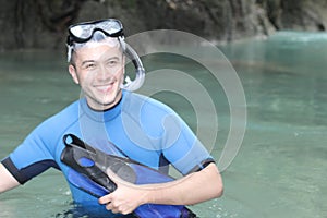 Diver smiling in ocean cavern