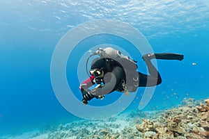 Diver swimming under water