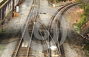 Diverging railroad tracks taken from a high angle.