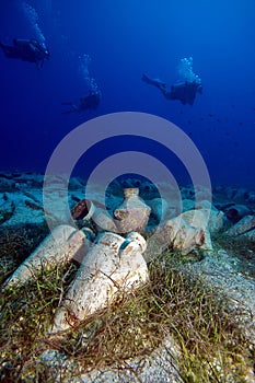 Divers and ancient amphoras