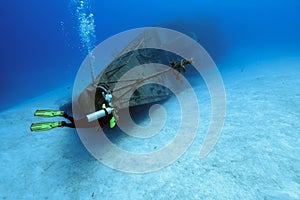 Divers exploring a shipwreck