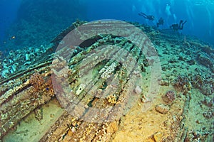 Divers exploring underwater wreckage