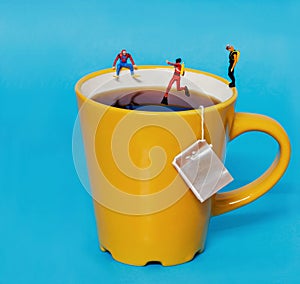 Divers jump into a giant tea mug