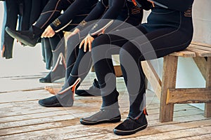 divers puts on a wetsuit and prepares to dive. Girl Scuba Diver