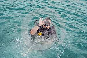 Divers on the surface of water ready to dive