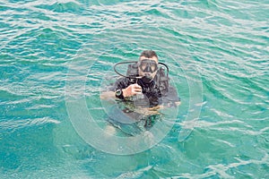 Divers on the surface of water ready to dive