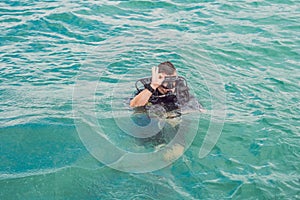 Divers on the surface of water ready to dive