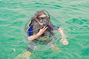 Divers on the surface of water ready to dive