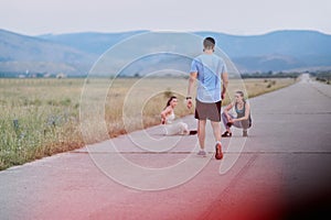 Diverse Athletic Warm-Up: Group Prepares for Intense Running Challenge.