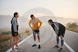 Diverse Athletic Warm-Up: Group Prepares for Intense Running Challenge.
