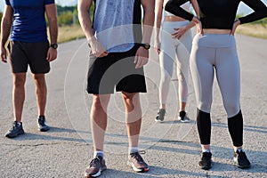 Diverse Athletic Warm-Up: Group Prepares for Intense Running Challenge.