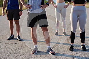 Diverse Athletic Warm-Up: Group Prepares for Intense Running Challenge.
