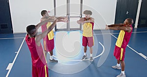 Diverse basketball team practices in an indoor court