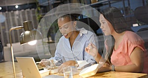 Diverse business colleagues share a meal at the office