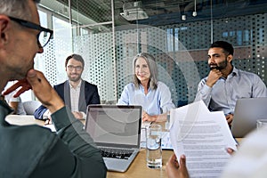 Diverse business people executive team having discussion at boardroom meeting.