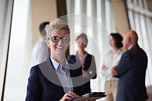 Diverse business people group with blonde woman in front