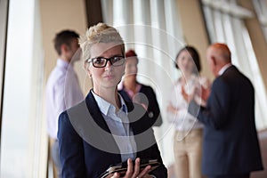 Diverse business people group with blonde woman in front