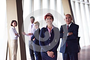 Diverse business people group with redhair woman in front