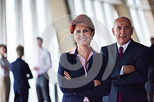 Diverse business people group with redhair woman in front