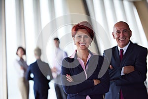 Diverse business people group with redhair woman in front