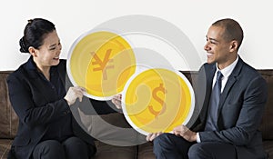 Diverse business people with money currency icons