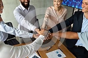 Diverse Business People Stacking Hands Together During Corporate Meeting In Office