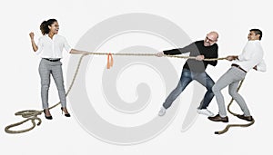 Diverse business people tugging on a rope