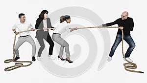 Diverse business people tugging on a rope