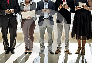 Diverse Business People Use Digital Devices