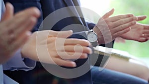 Diverse business team clapping hands while sitting at conference or meeting. Business people applauding with close up of