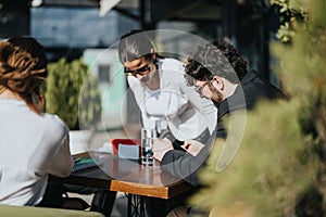 Diverse business team discussing growth strategies at an outdoor cafe