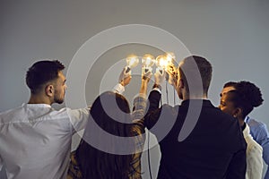Diverse business team joining light bulbs as symbol of sharing ideas in creative community