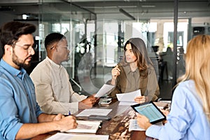 Diverse business team people having discussion at office meeting table.