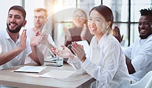 Diverse business team smiling to camera in office